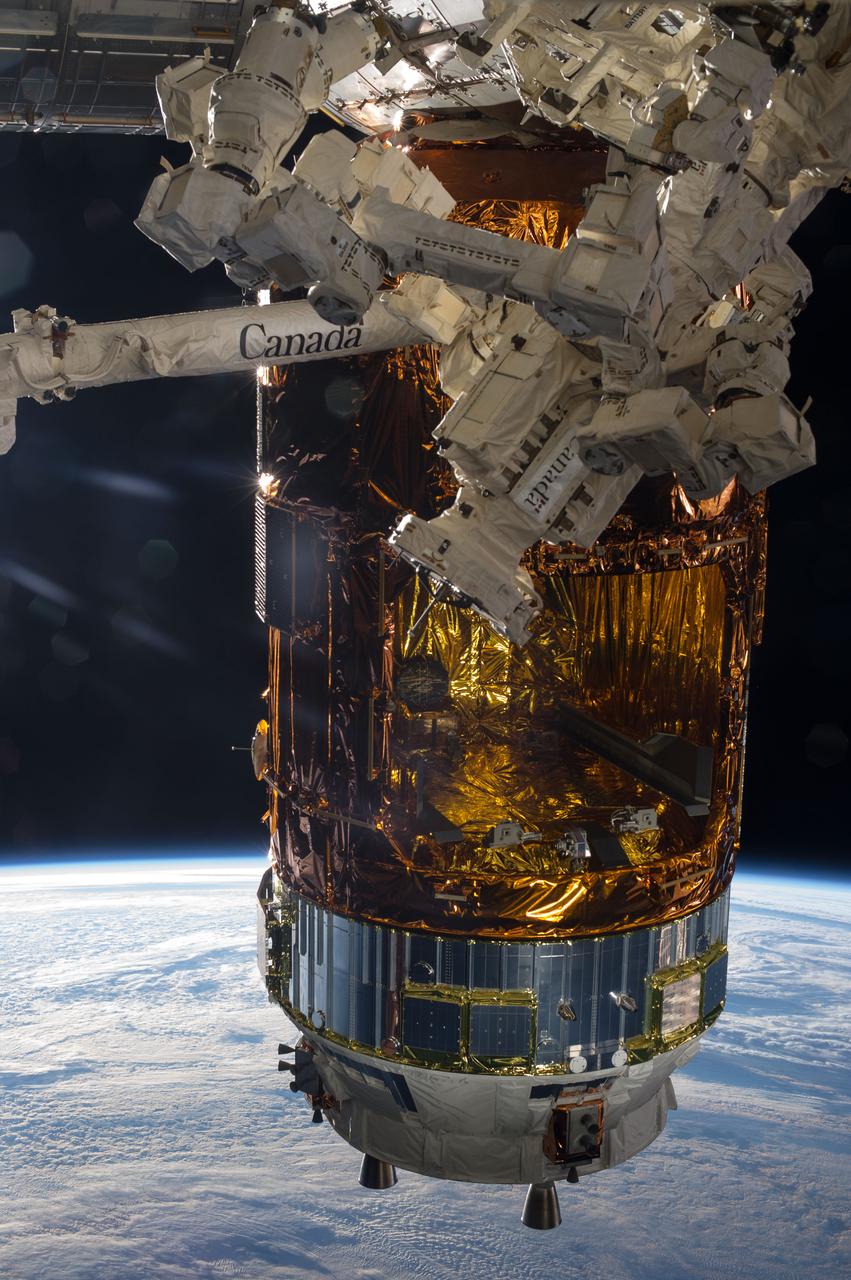 ISS036-E-034656 (19 Aug. 2013) --- The Japanese "Kounotori" H2 Transfer Vehicle-4 (HTV-4), currently attached to the Earth-facing port of the International Space Station's Harmony node, is featured in this image photographed by an Expedition 36 crew member on the station. Earth’s horizon and the blackness of space provide the backdrop for the scene.