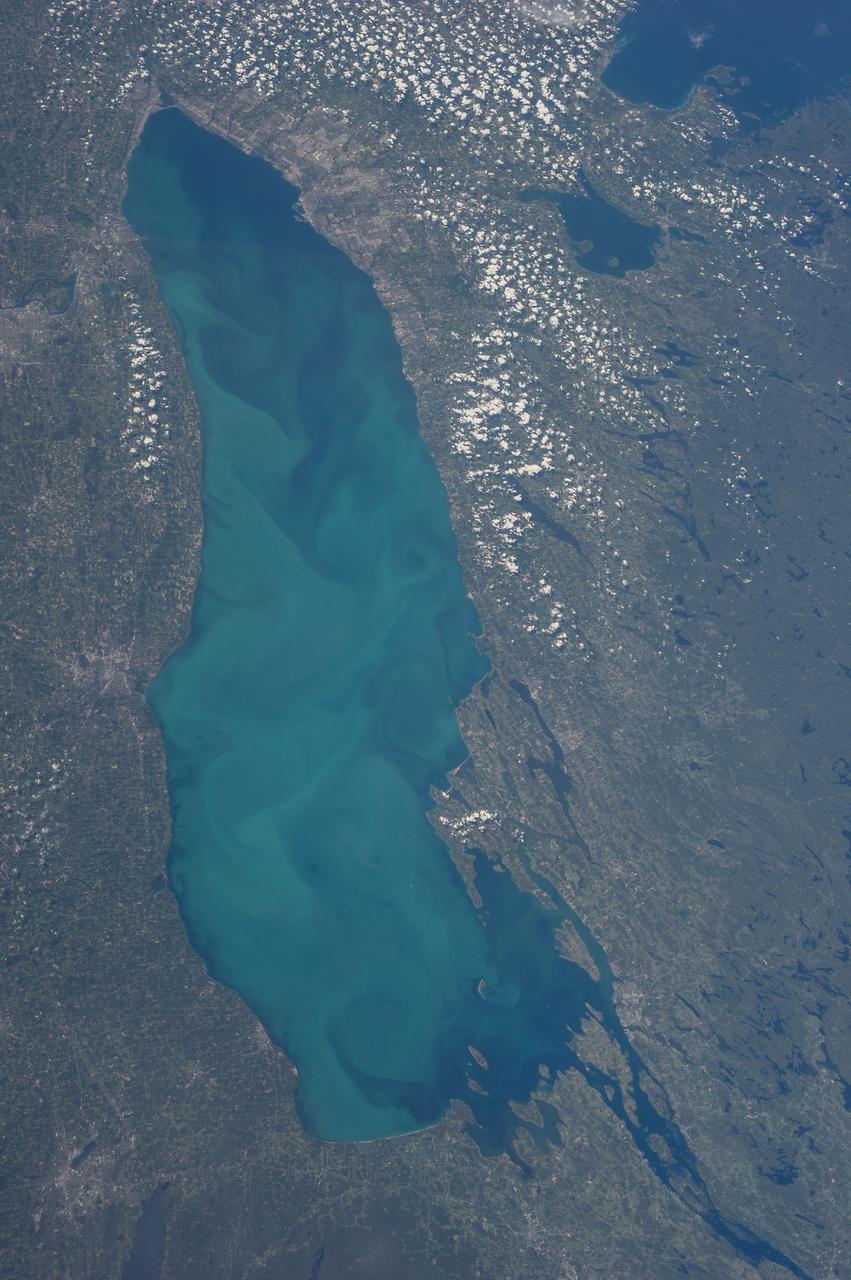 ISS036-E-035632 (24 Aug. 2013) --- One of the Expedition 36 crew members aboard the International Space Station recorded this  vertical image of Lake Ontario on Aug. 24, 2013. Lake Simcoe in Southern Ontario, Canada, is easily recognizable by its odd shape in upper right, just below the southeastern tip of Georgian Bay.