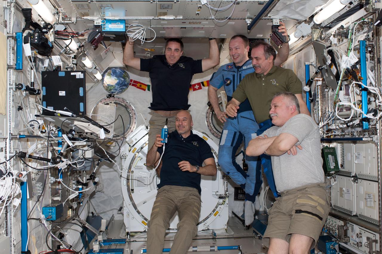 ISS036-E-035796 (23 Aug. 2013) --- Five of the six Expedition 36 crew members are pictured in the International Space Station?s Kibo laboratory during a daily planning conference. Pictured clockwise (from bottom left) are European Space Agency astronaut Luca Parmitano, NASA astronaut Chris Cassidy, Russian cosmonaut Alexander Misurkin, all flight engineers; Russian cosmonaut Pavel Vinogradov, commander; and Russian cosmonaut Fyodor Yurchikhin, flight engineer.