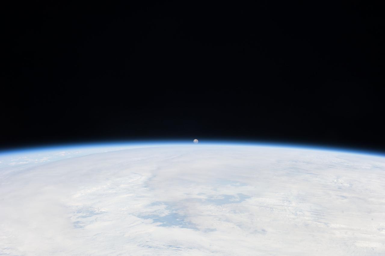 View of the distant Moon over an Earth limb taken by an Expedition 36 crew member on board the International Space Station (ISS). Per Twitter message: The setting moon.