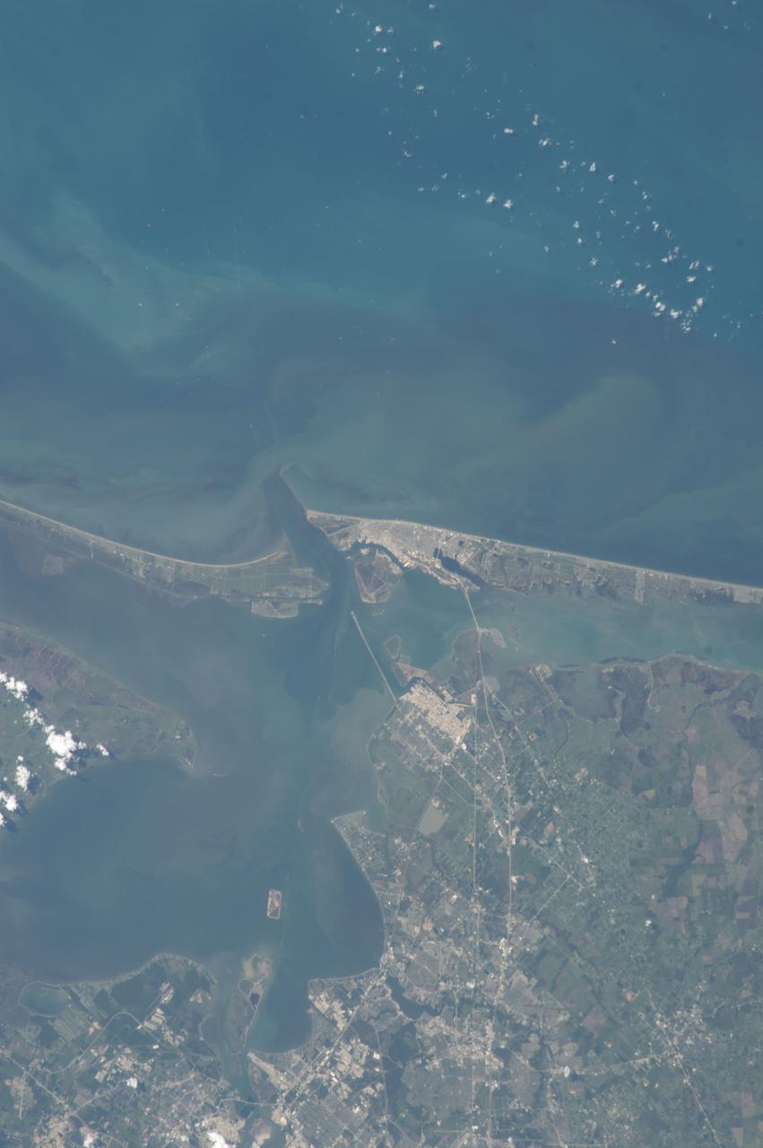 ISS036-E-037747 (28 Aug. 2013) --- One of the   Expedition 36 crew members aboard the International Space Station on Aug. 28 photographed this vertical image that shows much of Galveston County and a small portion of southeast Harris County, Texas. Gulf of Mexico waters take up the top half of the picture.  Galveston Island runs from just left of center through center right of the image, and the Bolivar Peninsula, highly impacted by Hurricane Ike five years ago, is the land mass at left center. Galveston Bay takes up much of the lower left quadrant of the pictured area. The NASA Johnson Space Center, the normal work place for NASA astronauts Chris Cassidy and Karen Nyberg, currently onboard the orbital complex, is in the bottom portion of the frame.