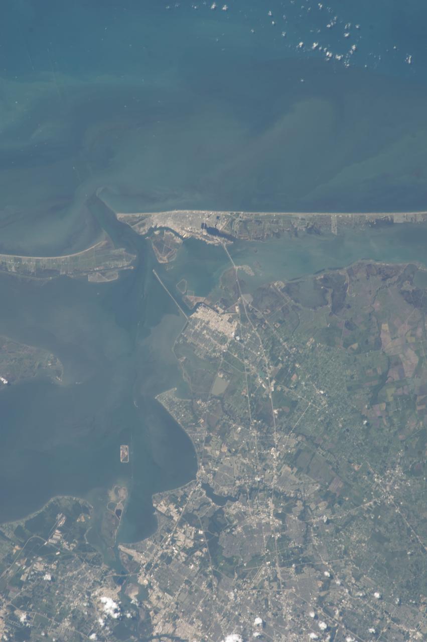 ISS036-E-037751 (28 Aug. 2013) --- One of the Expedition 36 crew members aboard the International Space Station on Aug. 28 photographed this vertical image that shows much of Galveston County and a small portion of southeast Harris County, Texas. Gulf of Mexico waters take up the top one third of the picture. Galveston Island runs from just left of top center through top right of the image, and the Bolivar Peninsula, highly impacted by Hurricane Ike five years ago, is the land mass at top left. Galveston Bay is on the left side of the lower part of the frame. The NASA Johnson Space Center, the normal work place for NASA astronauts Chris Cassidy and Karen Nyberg, currently onboard the orbital complex, is in the bottom portion of the frame.