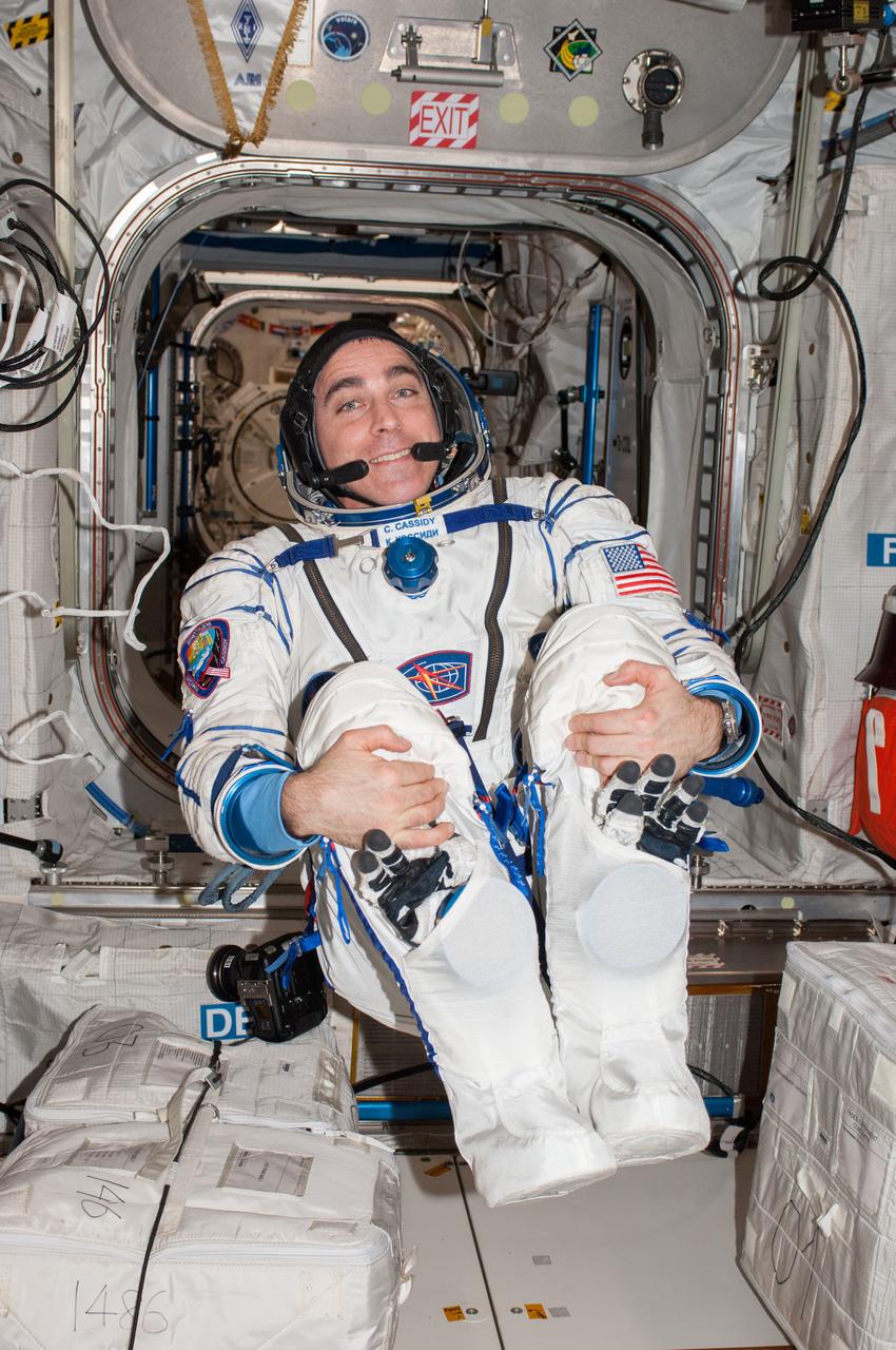 ISS036-E-039045 (29 Aug. 2013) --- NASA astronaut Chris Cassidy, Expedition 36 flight engineer, wearing a Russian Sokol launch and entry suit, poses for a photo in the Columbus laboratory of the International Space Station.