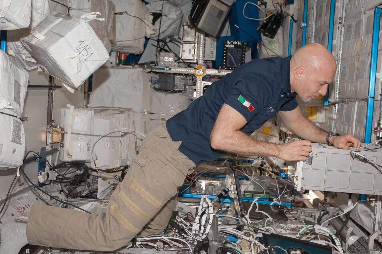 ISS036-E-039421 (3 Sept. 2013) --- European Space Agency astronaut Luca Parmitano, Expedition 36 flight engineer, works in the Columbus laboratory of the International Space Station.