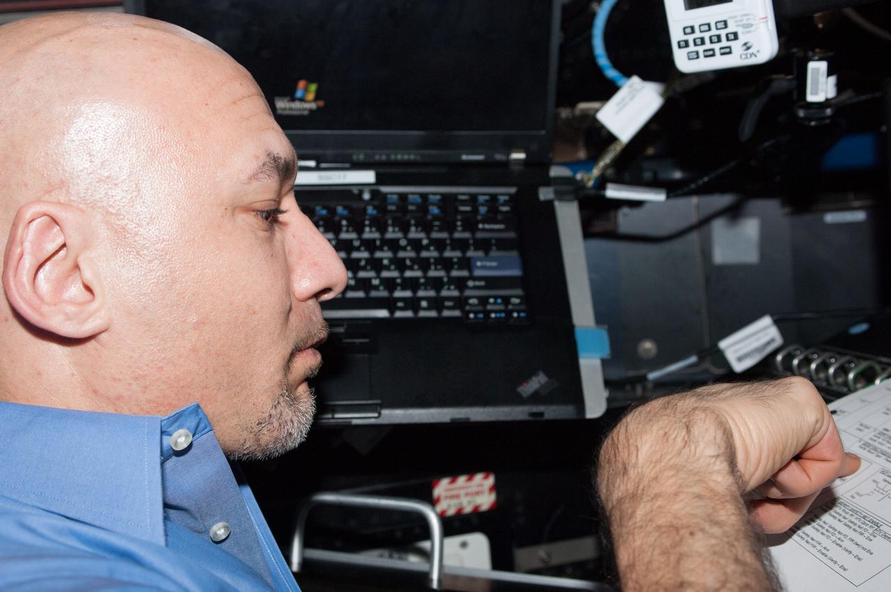 ISS036-E-039425 (3 Sept. 2013) --- European Space Agency astronaut Luca Parmitano, Expedition 36 flight engineer, reads over a procedures checklist in the International Space Station?s Cupola during preparations to release the Japanese "Kounotori" H2 Transfer Vehicle-4 (HTV-4) ending its one-month stay at the space station. The automated resupply craft will be grappled by the Canadarm2, removed from the Harmony node and released for a destructive reentry into Earth?s atmosphere.