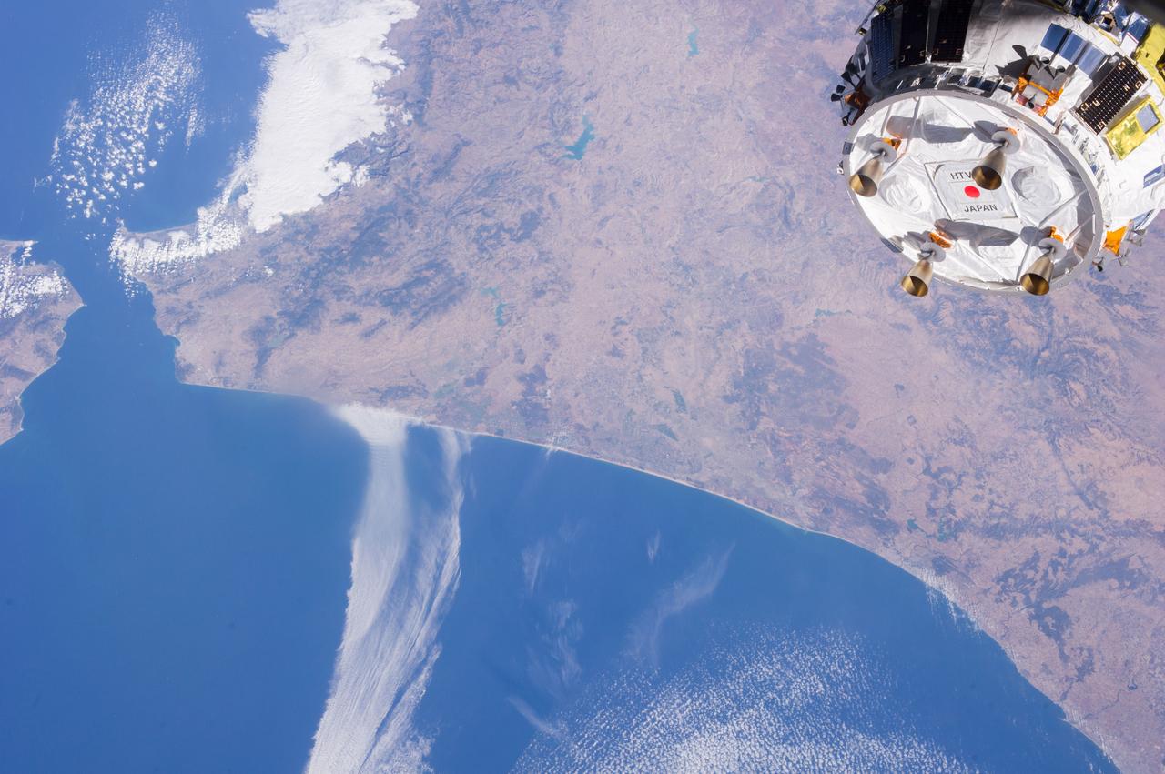 ISS036-E-039525 (04 Sept. 2013) ---  One of the Expedition 36 crew members aboard the International Space Station took this picture showing part of the Japanese HTV-4 unmanned cargo spacecraft, backdropped against countries in northern Africa,  following its unberthing from the orbital outpost.  HTV-4, after backing away from the flying complex, headed for re-entry into Earth's atmosphere, burning upon re-entry. The Strait of Gibraltar, where the Atlantic Ocean and the Mediterranean Sea meet, is in the upper left quadrant of the photo.  HTV-4 was launched by Japan?s Aerospace Exploration Agency (JAXA) on Aug. 4 of this year in order to bring up supplies for the astronauts and cosmonauts onboard the station.