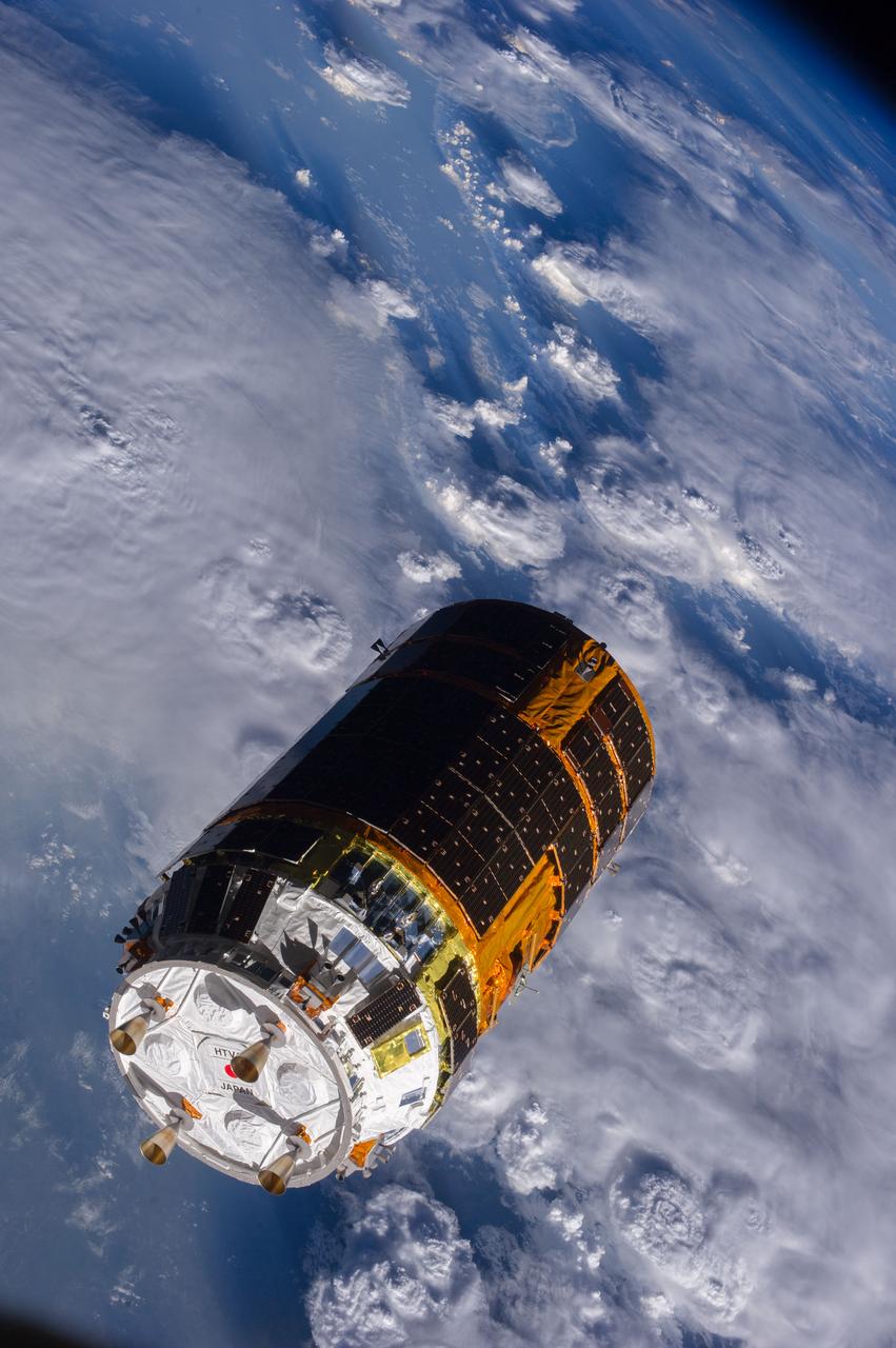 One of the Expedition 36 crew members aboard the International Space Station took this picture of the Japanese HTV-4 unmanned cargo spacecraft,backdropped against the Earth,following its unberthing and release from the orbital outpost. HTV-4,after backing away from the flying complex,headed for re-entry into Earth's atmosphere,burning upon re-entry. Per Twitter message: And, shortly after release of #HTV4, flying over Africa (The storm clouds were amazing).