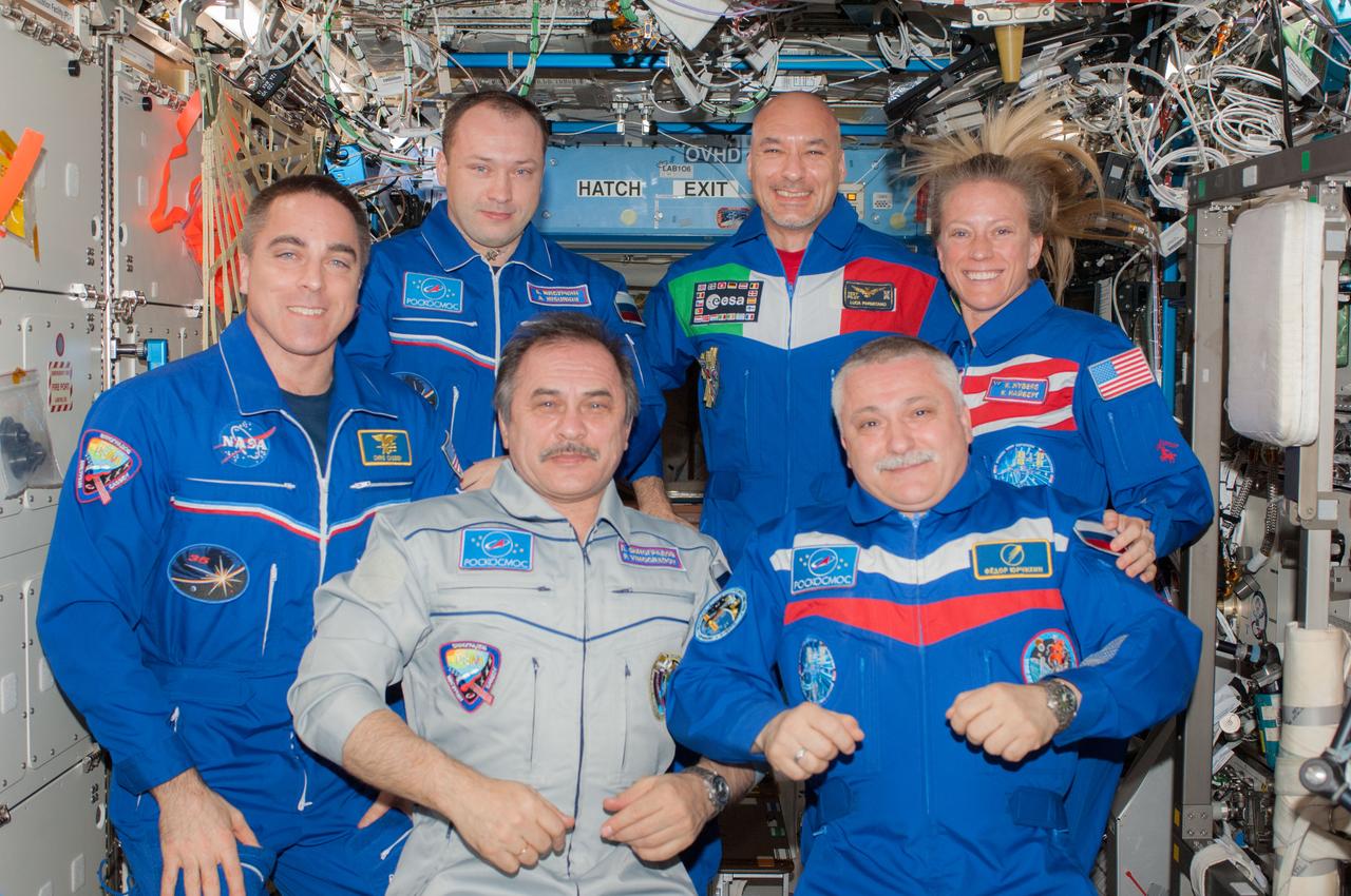 ISS036-E-048237 (9 Sept. 2013) --- Expedition 35/36 and Expedition 36/37 crew members pose for a group portrait in the International Space Station’s Destiny laboratory following the ceremony of changing-of-command from Expedition 36 to Expedition 37. Pictured on the front row (from the left) are NASA astronaut Chris Cassidy, Expedition 36 flight engineer; Russian cosmonaut Pavel Vinogradov, Expedition 36 commander; and Russian cosmonaut Fyodor Yurchikhin, Expedition 37 commander. Pictured on the back row (from the left) are Russian cosmonaut Alexander Misurkin, Expedition 36 flight engineer; European Space Agency astronaut Luca Parmitano and NASA astronaut Karen Nyberg, both Expedition 37 flight engineers.