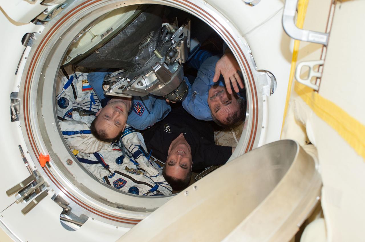 ISS036-E-048267 (10 Sept. 2013) --- Russian cosmonaut Pavel Vinogradov (right), Expedition 36 commander; along with NASA astronaut Chris Cassidy (center) and Russian cosmonaut Alexander Misurkin, both flight engineers, are pictured in the Soyuz TMA-08M spacecraft currently docked to the Poisk Mini-Research Module 2 (MRM2) of the International Space Station. The trio is preparing to undock from Poisk in their Soyuz spacecraft, ending a five-and-a-half month stay at the station.