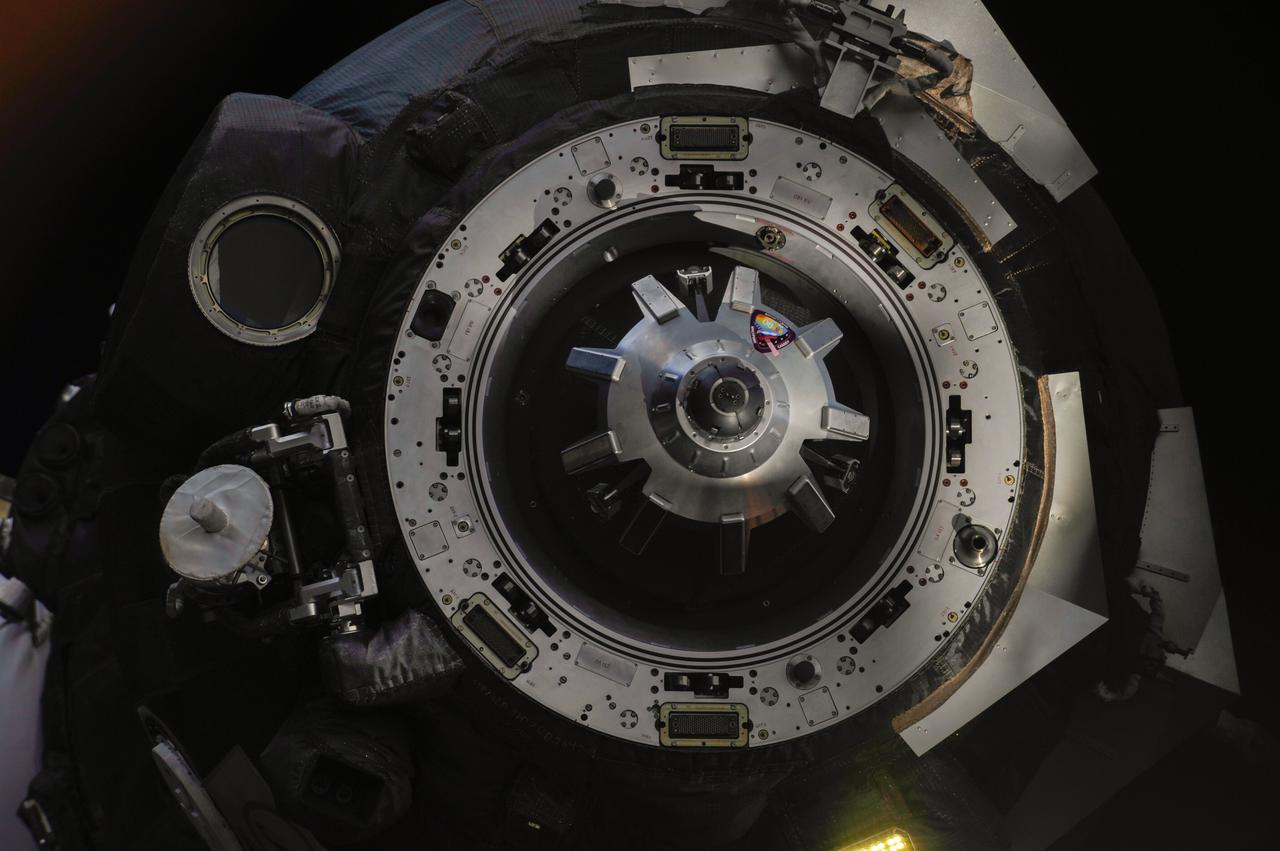 ISS037-E-000018 (10 Sept. 2013) --- This close-up view shows the docking mechanism of the Soyuz TMA-08M spacecraft as it departs from the International Space Station?s Poisk Mini-Research Module 2 (MRM2) and heads toward a landing in a remote area near the town of Zhezkazgan, Kazakhstan, on Sept. 11, 2013 (Kazakhstan time). Russian cosmonaut Pavel Vinogradov, Expedition 36 commander; along with NASA astronaut Chris Cassidy and Russian cosmonaut Alexander Misurkin, both flight engineers, are ending a five-and-a-half month stay at the space station where they served as members of the Expedition 35 and 36 crews.