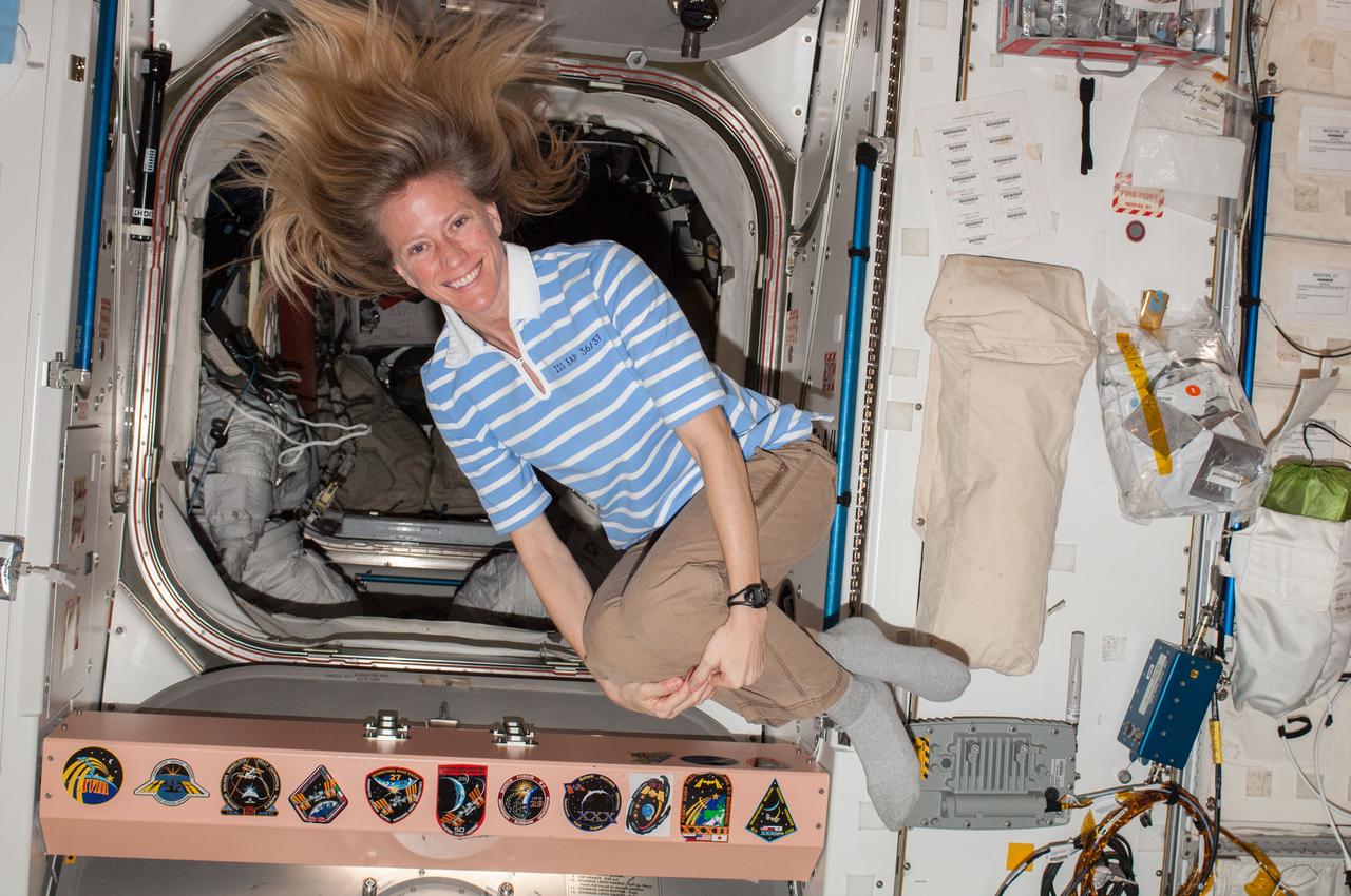 ISS037-E-001092 (16 Sept. 2013) --- NASA astronaut Karen Nyberg, Expedition 37 flight engineer, poses for a photo while floating freely in the Unity node of the International Space Station.