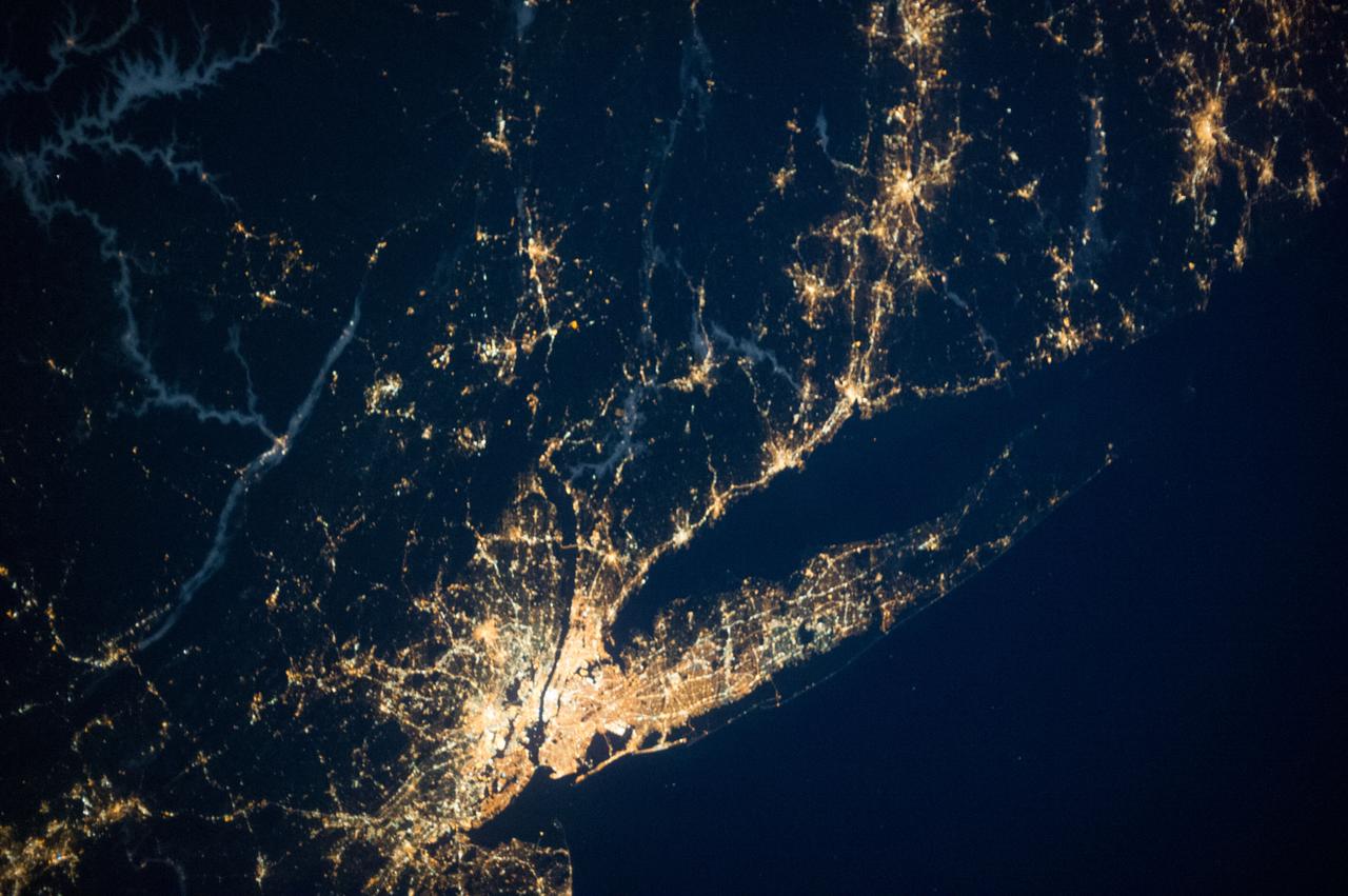 ISS037-E-001802 (20 Sept. 2013) --- One of three Expedition 37 crew members aboard the International Space Station on Sept. 20 photographed this night image showing parts of the New Jersey-New York-Connecticut area of the Atlantic coast. Long Island, NY is a tell-tale identifier near right center as it juts out into the Atlantic, with Long Island Sound to its west. The New York metropolitan area is largely visible in the bottom center of the frame, with parts of New Jersey at left and parts of Connecticut at right.