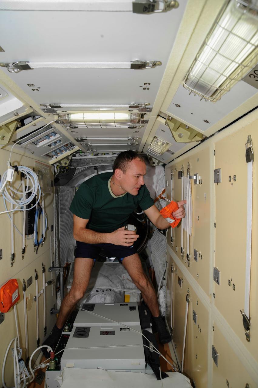 ISS037-E-002634 (26 Sept. 2013) --- Recently-arrived Russian cosmonaut Sergey Ryazanskiy, Expedition 37 flight engineer, is pictured in the Zarya Functional Cargo Block (FGB) of the International Space Station.