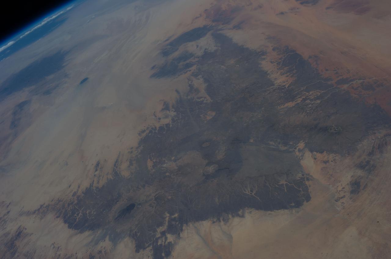 Earth Observation taken during a day pass by the Expedition 37 crew aboard the International Space Station (ISS). Per Twitter message: Northern Chad, looking north across Libya.
