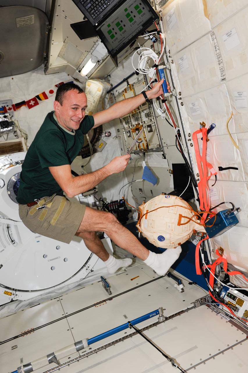 ISS037-E-003215 (27 Sept. 2013) --- Russian cosmonaut Sergey Ryazanskiy, Expedition 37 flight engineer, works in the Kibo laboratory of the International Space Station.