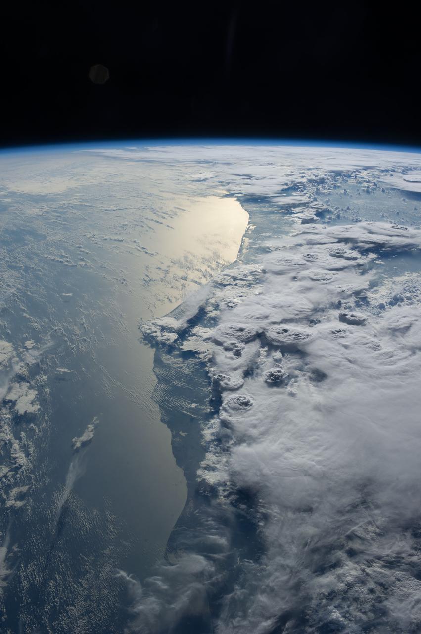Earth observation taken during a day pass by the Expedition 37 crew. Per Twitter message these are storms over Ghana.