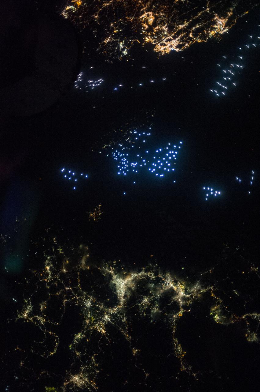 Earth observation taken during a night pass by the Expedition 37 crew. Per Twitter message: The Korea Strait.