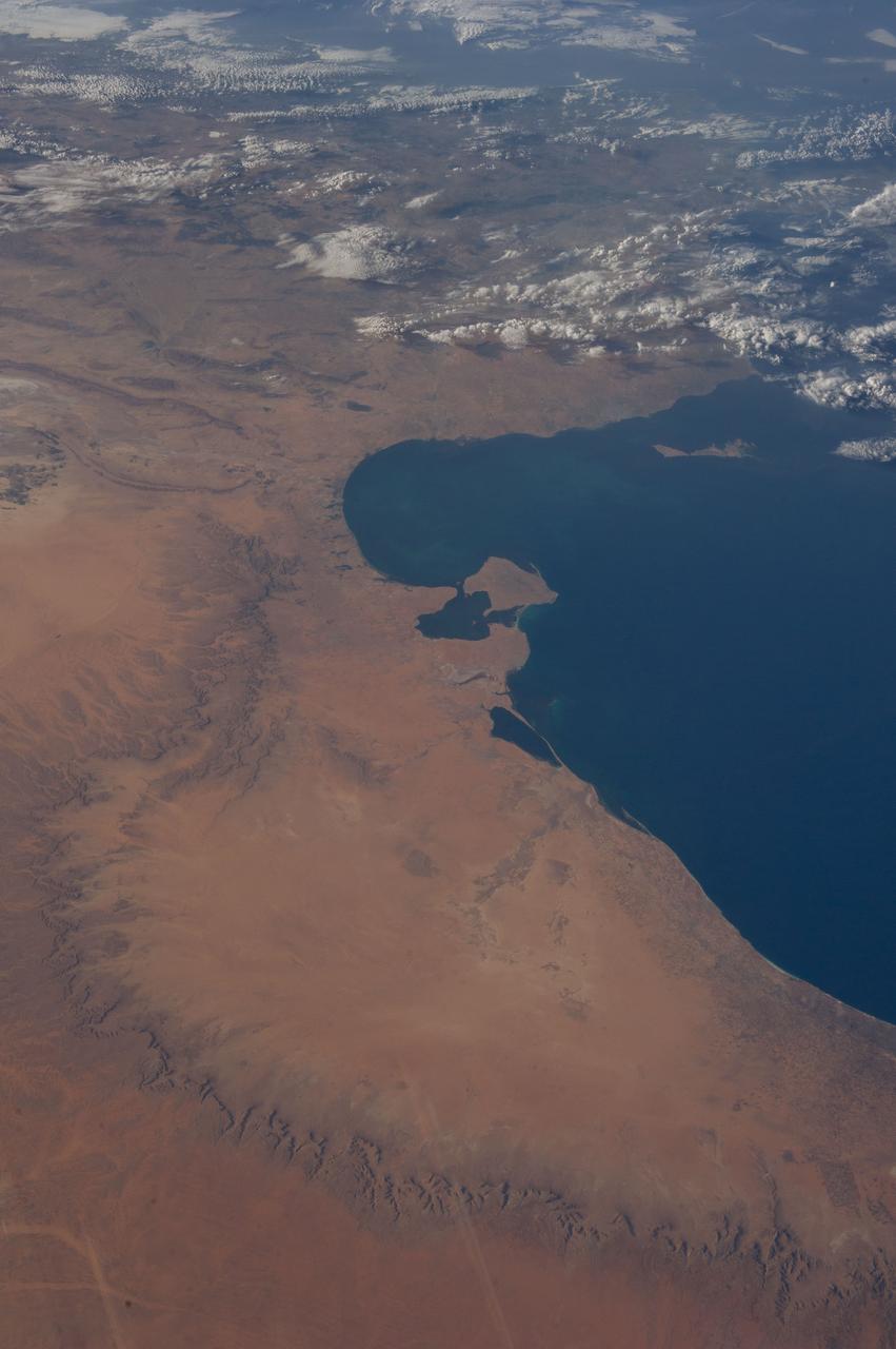 Earth observation taken during a day pass by the Expedition 37 crew. Per Twitter message: Mediterranean coast of Tunisia & northwest Libya.