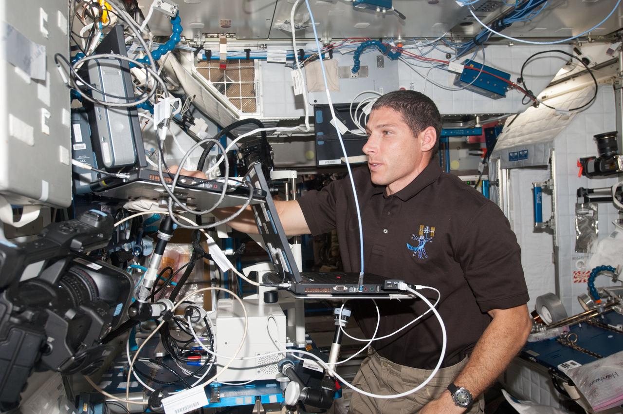 ISS037-E-013962 (15 Oct. 2013) --- NASA astronaut Michael Hopkins, Expedition 37 flight engineer, enters data in a computer in the Harmony node of the International Space Station.