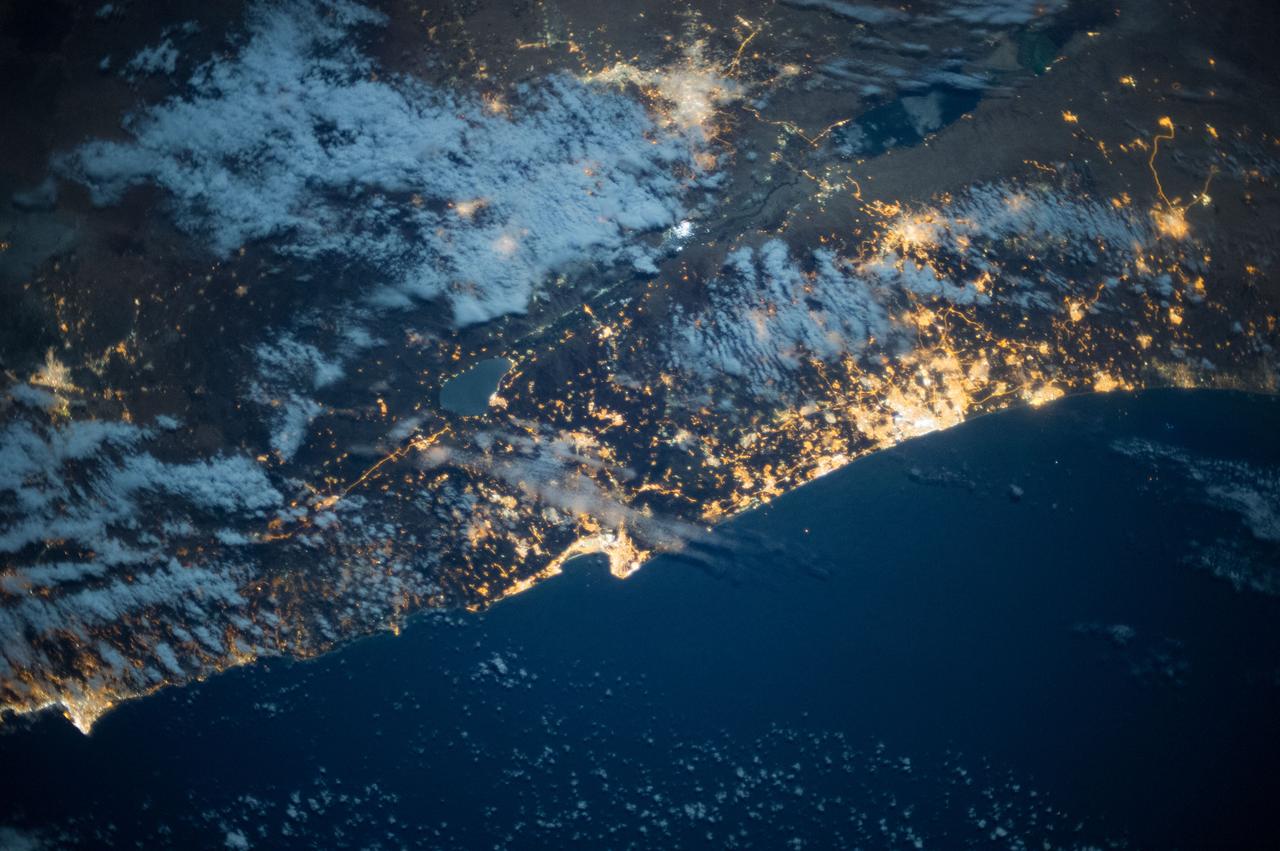 Earth observation taken during a night pass by the Expedition 37 crew.  City lights visible.  Per Twitter message this is eastern Mediterranean coast, Tel Aviv to Beirut.
