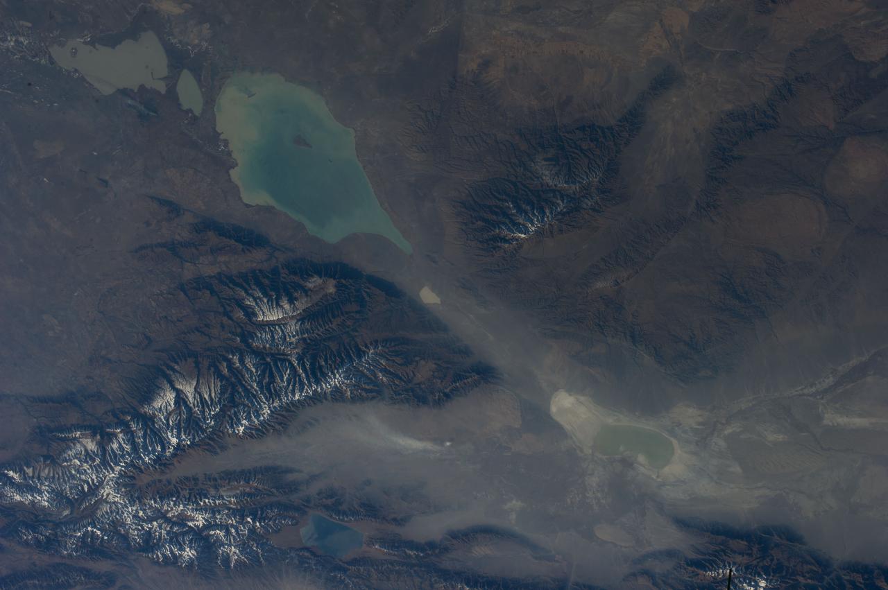Earth observation taken during a day pass by the Expedition 37 crew.  Possibly identified as Dzungarian Gate, mountain pass between China and Kazakhstan.