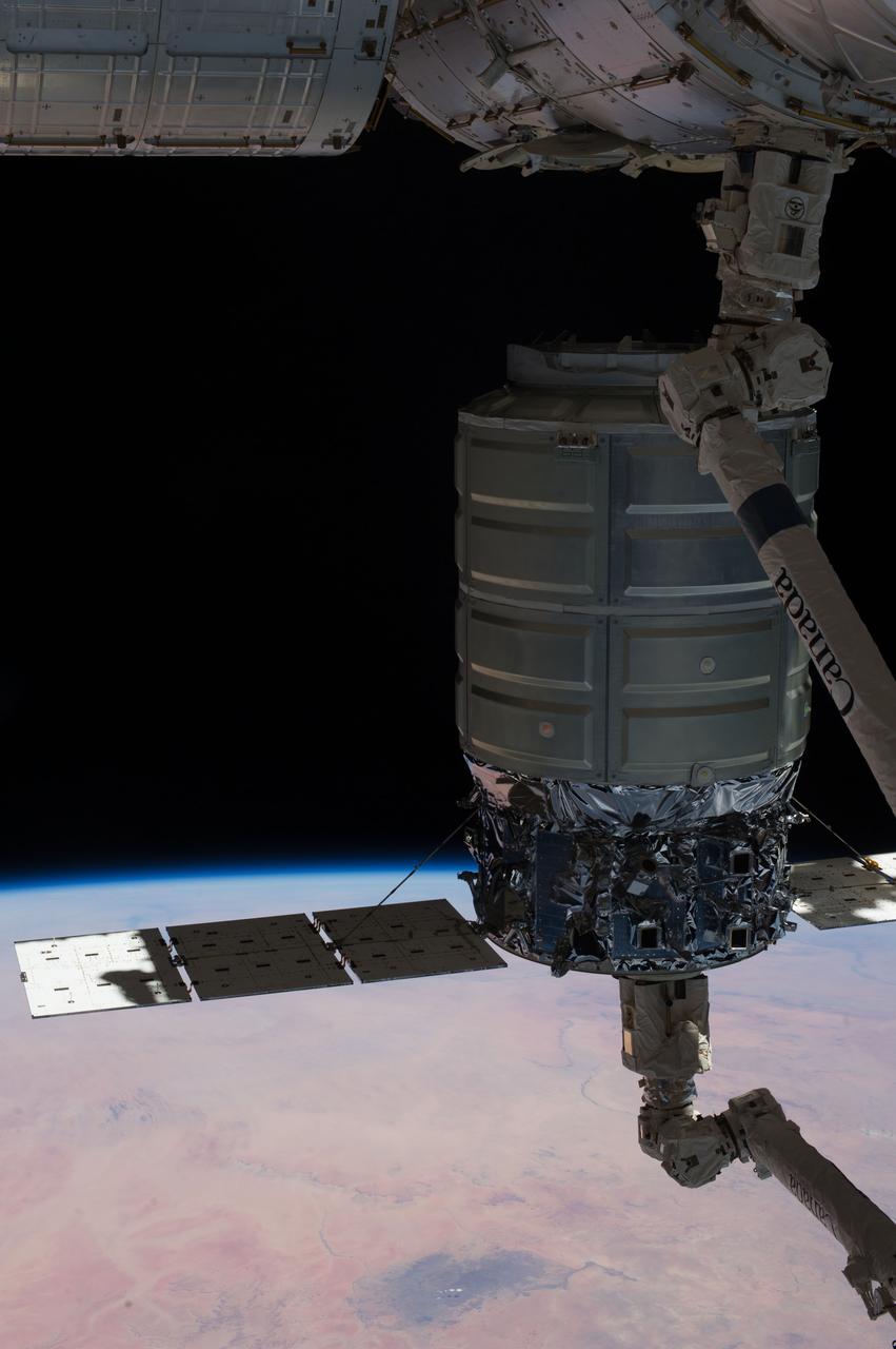The International Space Stations Remote Manipulator System (SSRMS) arm or Canadarm2 prepares to release the Orbital Sciences Cygnus commercial craft after three weeks at the space station.