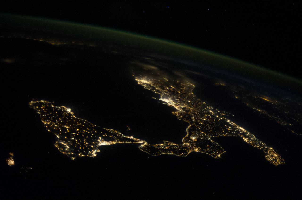 ISS037-E-018864 (23 Oct. 2013) --- This night image of most of Italy and all of Sicily was photographed by one of the Expedition 37 crew members aboard the International Space Station flying approximately 240 miles above Earth on Oct. 23,  2013. The night lights of Rome and Naples are visible near the center of the frame. Many other major cities are also visible by their lights.  The Adriatic Sea is on the east (right) side of Italy.