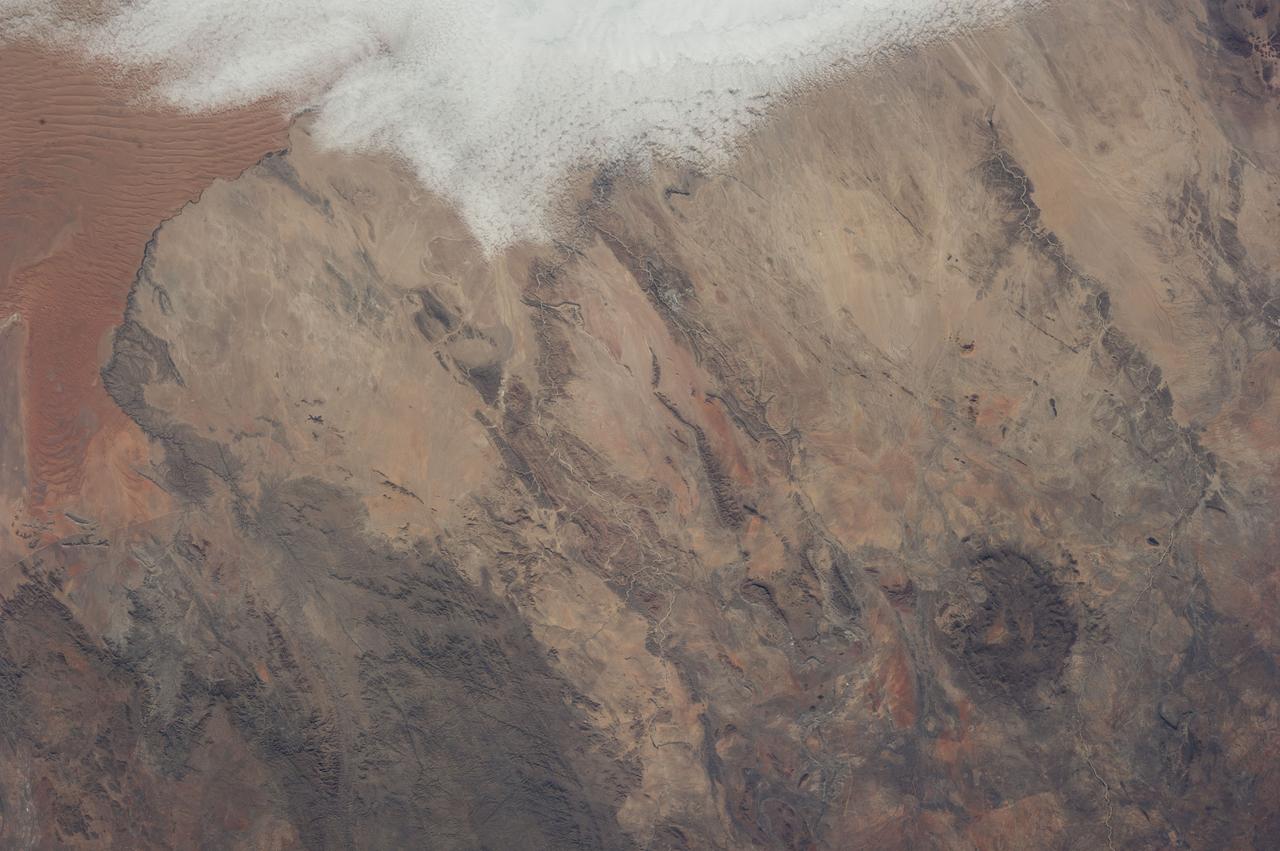 Earth observation taken during a day pass by an Expedition 37 crew member on board the International Space Station (ISS). Identified via Twitter message as west central coast of Namibia.