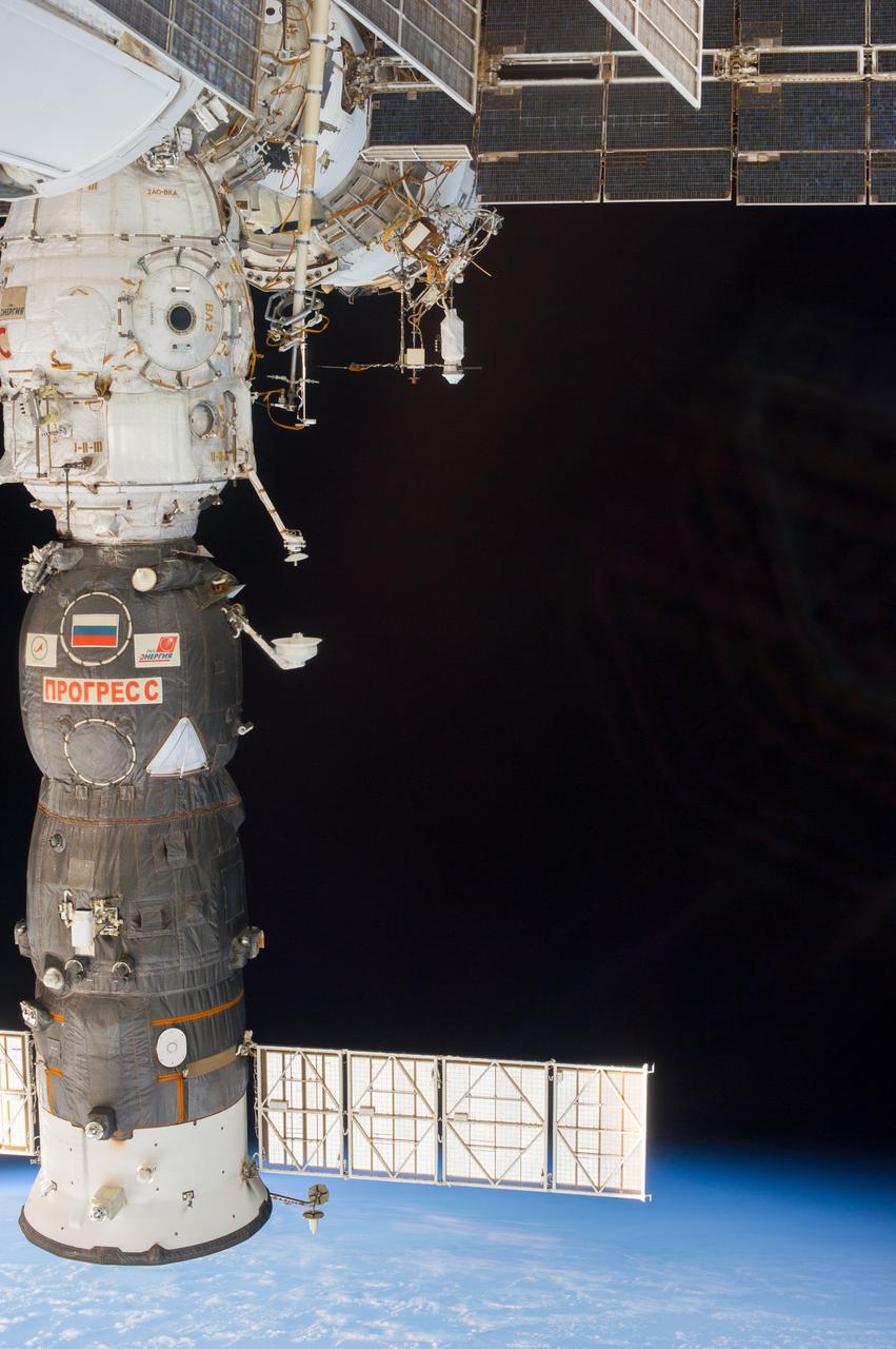 Earth observation taken during a day pass by the Expedition 37 crew. A docked Progress spacecraft is visible in the foreground.