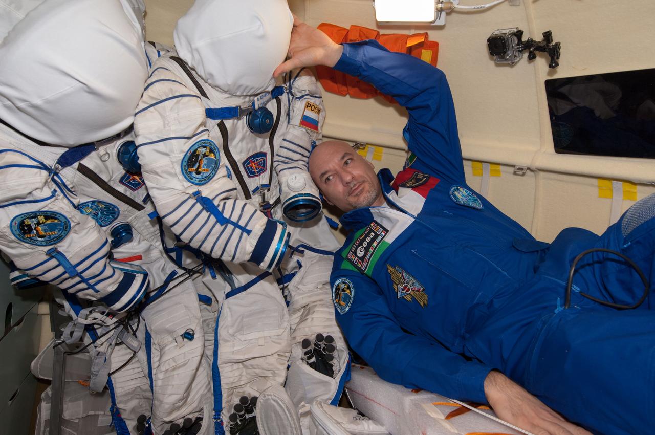 ISS037-E-024928 (31 Oct. 2013) --- European Space Agency astronaut Luca Parmitano, Expedition 37 flight engineer, is pictured during preparations to relocate the Soyuz TMA-09M spacecraft from the International Space Station?s Rassvet module to the aft port of the Zvezda Service Module. Parmitano, Russian cosmonaut Fyodor Yurchikhin, commander; and NASA astronaut Karen Nyberg, flight engineer, are scheduled to undock their spacecraft at 4:34 a.m. (EDT) on Nov. 1 for the planned 24-minute maneuver.