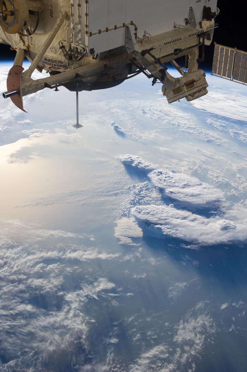 Earth Observation taken during a day pass by the Expedition 37 crew. Identified via Twitter message as storms over the Mediterranean and a nadir docking port left empty after movement of the Soyuz.