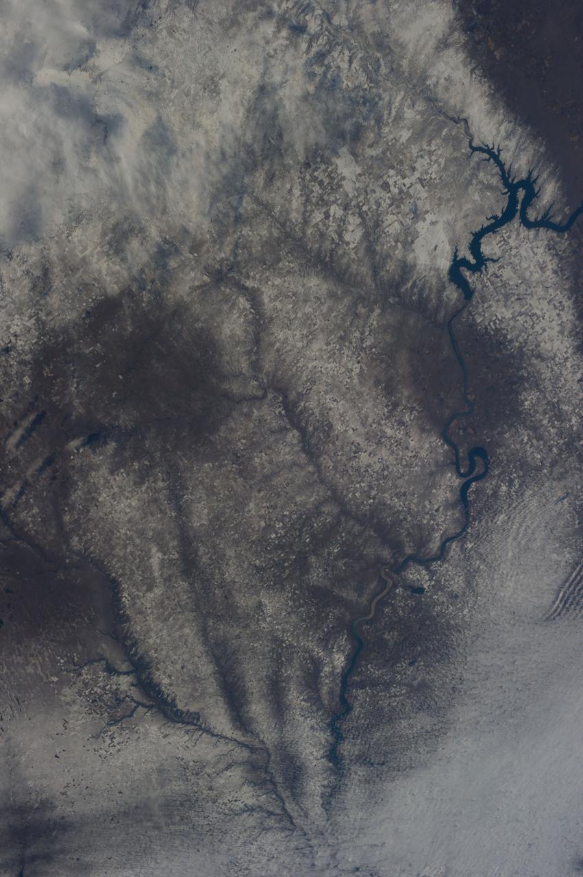 Earth observation taken during day pass by an Expedition 37 crew member on board the International Space Station (ISS).  Possibly Identified as snow covered South Dakota,along the Missouri river.