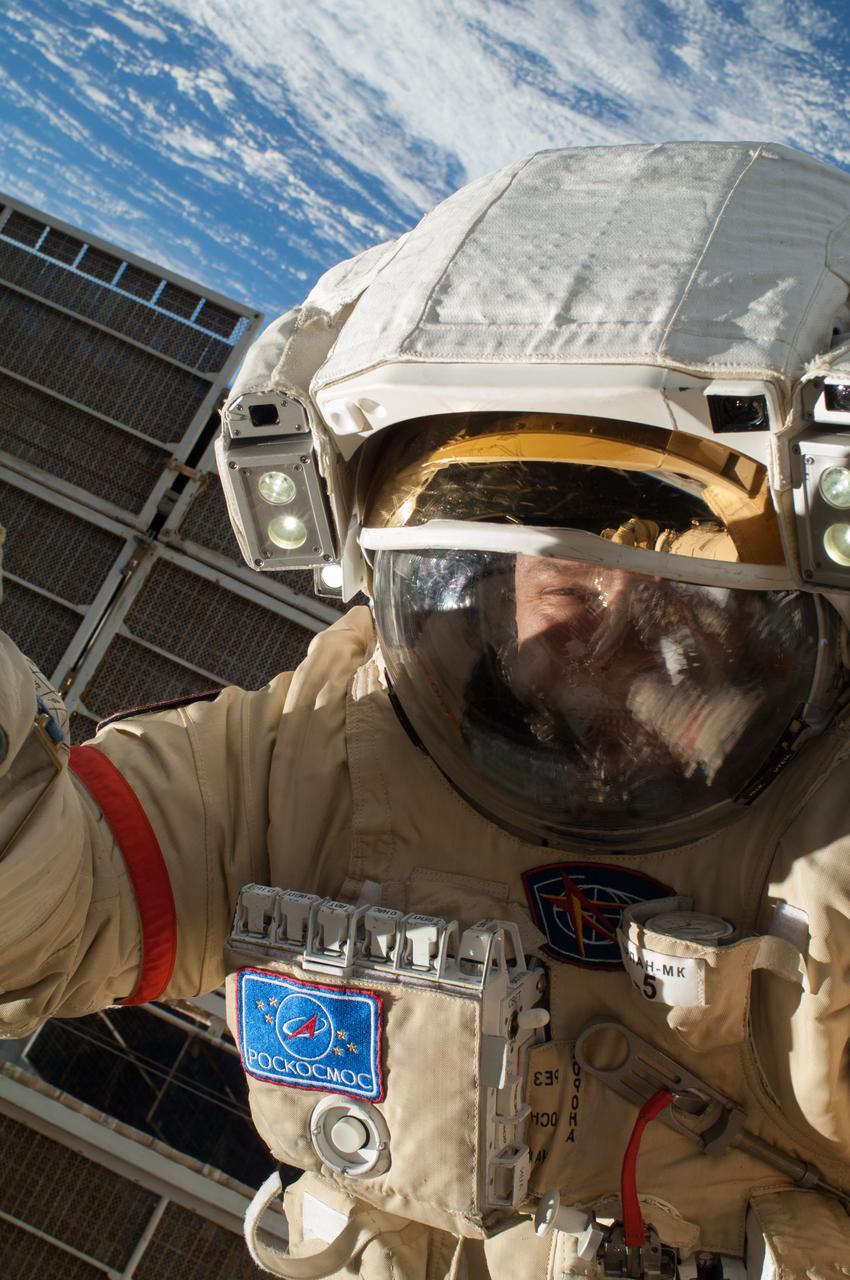 ISS037-E-028067 (9 Nov. 2013) --- Russian cosmonaut Oleg Kotov, Expedition 37 flight engineer, attired in a Russian Orlan spacesuit, participates in a session of extravehicular activity (EVA) in support of assembly and maintenance on the International Space Station. During the five-hour, 50-minute spacewalk, Kotov and Russian cosmonaut Sergey Ryazanskiy (out of frame) continued the setup of a combination EVA workstation and biaxial pointing platform that was installed during an Expedition 36 spacewalk on Aug. 22.