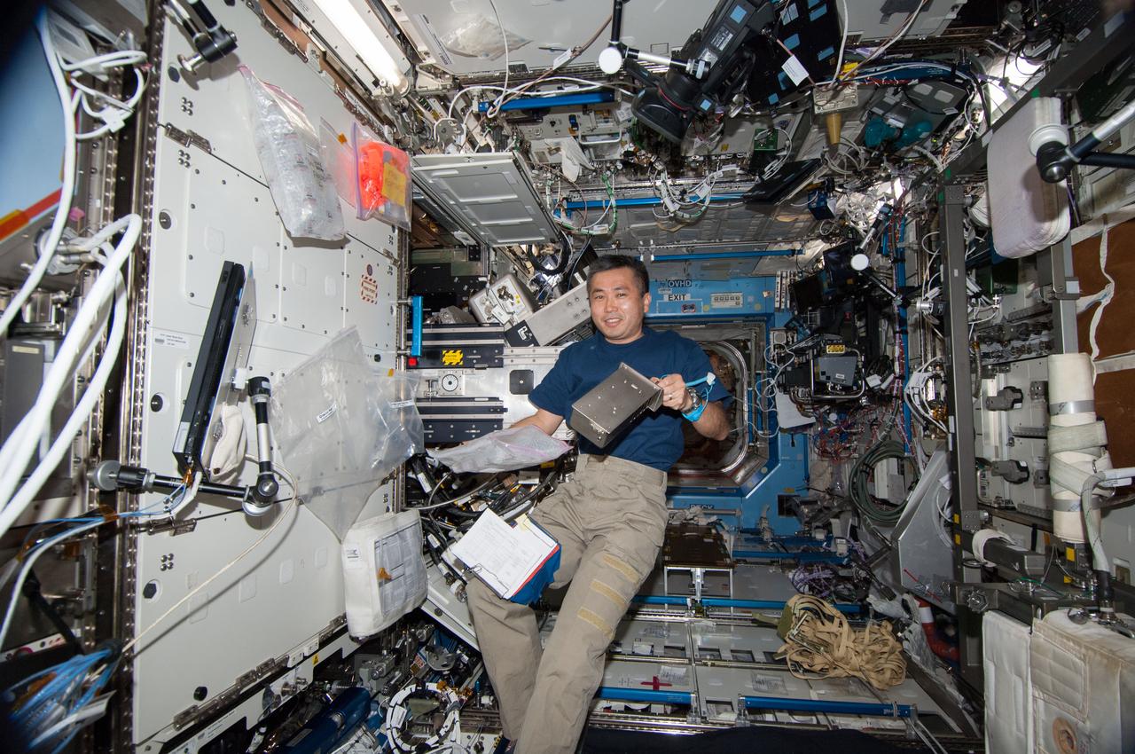 ISS037-E-028162 (9 Nov. 2013) --- Japan Aerospace Exploration Agency astronaut Koichi Wakata, Expedition 38 flight engineer, works with hardware in the Destiny laboratory of the International Space Station.