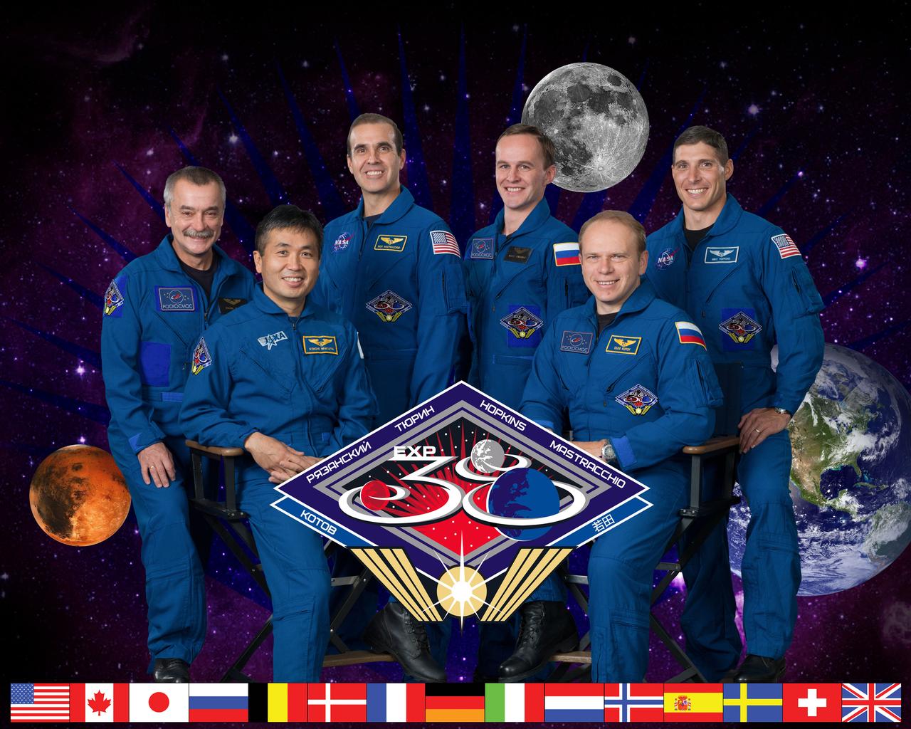 Official portrait for Expedition 38 – Crew members are: (Soyuz 36) – Oleg Kotov, Sergey Ryazanskiy, Mike Hopkins; (Soyuz 37): Mikhail Tyurin, Richard Mastracchio, Koichi Wakata. (Also known as Expedition 38/39). Photo Date: October 3, 2012. Location: Building 8, Room 183 - Photo Studio. Photographer: Robert Markowitz