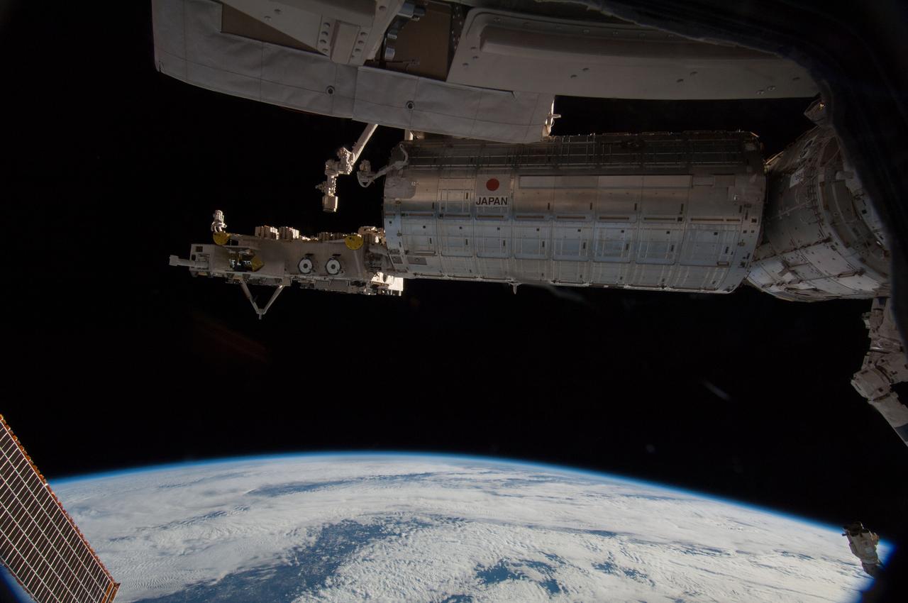 ISS038-E-000257 (12 Nov. 2013) --- Backdropped by the darkness of space and a white and blue Earth, the Kibo laboratory of the Japan Aerospace Exploration Agency is featured in this image photographed from inside the Cupola by one of the Expedition 38 crew members aboard the International Space Station.