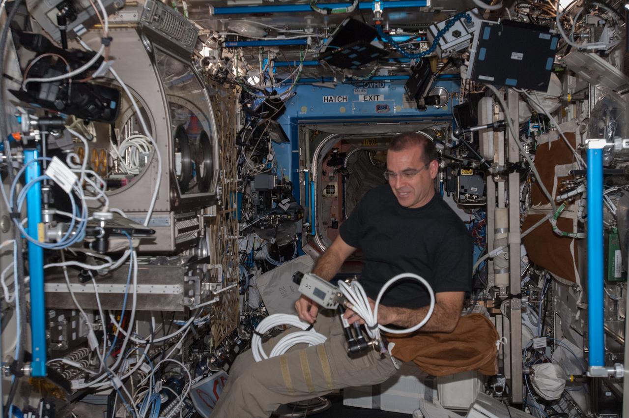 ISS038-E-000714 (13 Nov. 2013) --- NASA astronaut Rick Mastracchio, Expedition 38 flight engineer, works with equipment in the Destiny laboratory of the International Space Station.