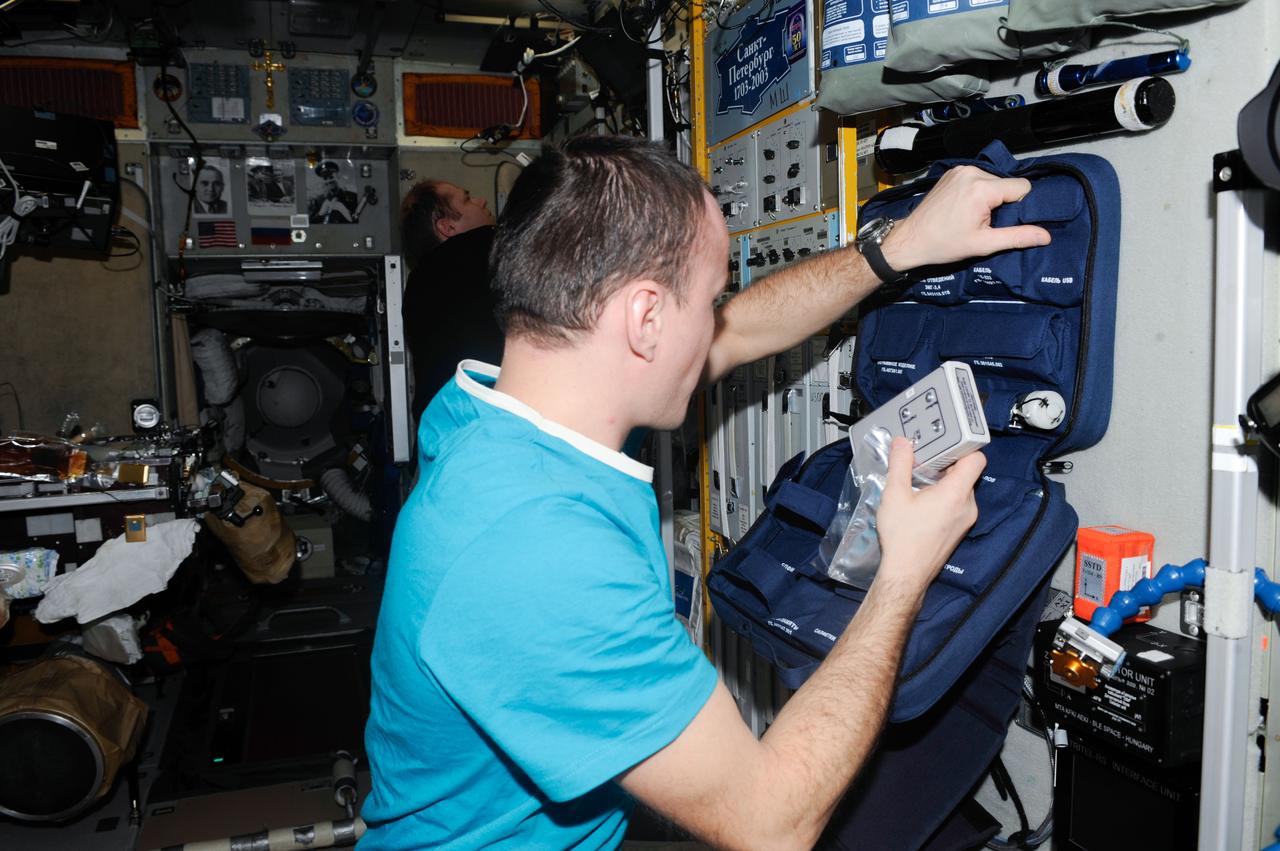 ISS038-E-002151 (18 Nov. 2013) --- Russian cosmonaut Sergey Ryazanskiy, Expedition 38 flight engineer, works in the Zvezda Service Module of the International Space Station.