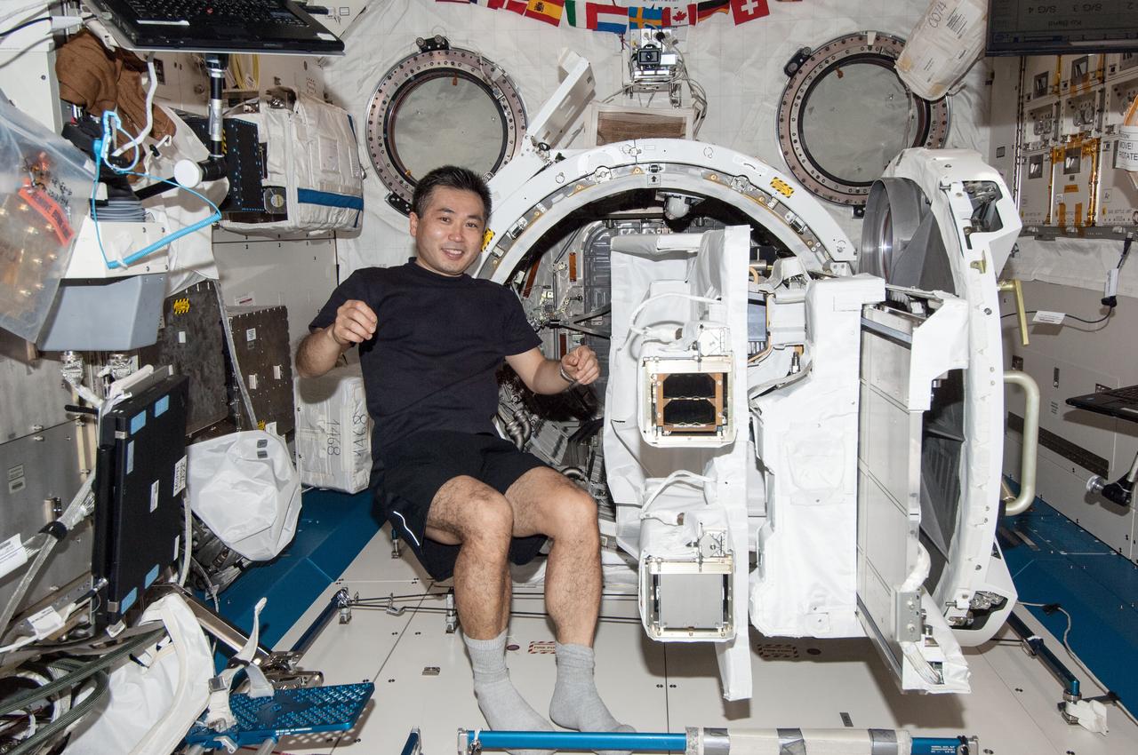 View of Koichi Wakata,Expedition 38 Flight Engineer (FE),in the Japanese Experiment Module (JEM) Pressurized Module (JPM). JEM Small Satellite Orbital Deployer (J-SSOD) installed on the Multi-Purpose Experiment Platform (MPEP),is visible. Photo was taken during Expedition 38. Image was released by astronaut on Twitter.