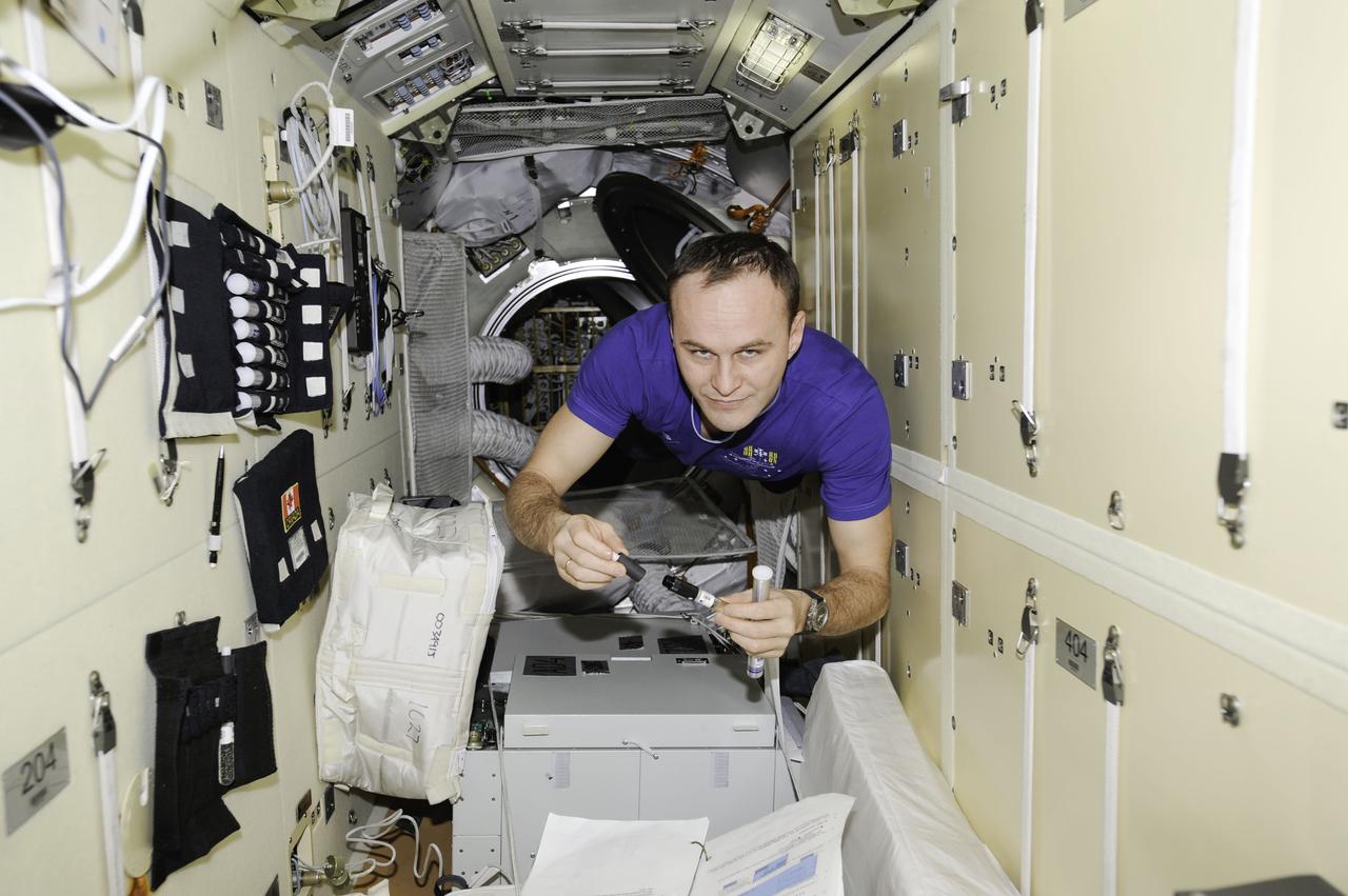 ISS038-E-006668 (22 Nov. 2013) --- Russian cosmonaut Sergey Ryazanskiy, Expedition 38 flight engineer, floats freely while working in the Russian segment of the International Space Station.
