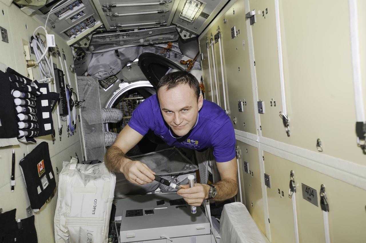 ISS038-E-006669 (22 Nov. 2013) --- Russian cosmonaut Sergey Ryazanskiy, Expedition 38 flight engineer, floats freely while working in the Russian segment of the International Space Station.