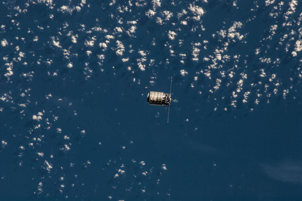 ISS038-E-027441 (12 Jan. 2014) --- The Orbital Sciences Corp. Cygnus commercial cargo craft is photographed by an Expedition 38 crew member on the International Space Station during rendezvous and berthing operations on Jan. 12, 2014. A blue and white part of Earth provides the backdrop for the scene.