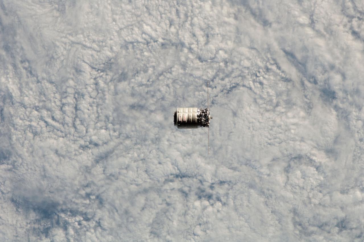 ISS038-E-027448 (12 Jan. 2014) --- The Orbital Sciences Corp. Cygnus commercial cargo craft is photographed by an Expedition 38 crew member on the International Space Station during rendezvous and berthing operations on Jan. 12, 2014. A cloud-covered part of Earth provides the backdrop for the scene.