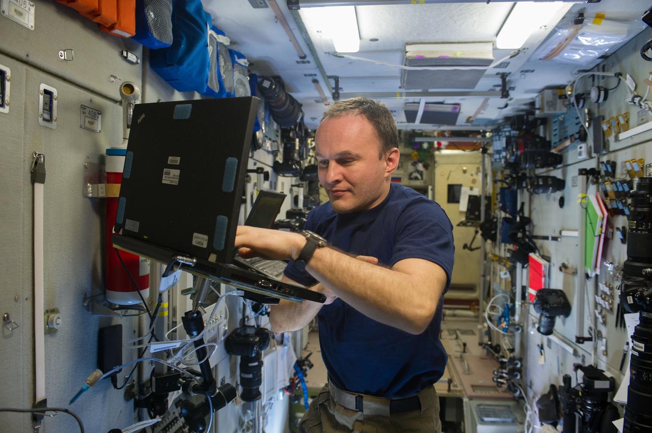 ISS038-E-032824 (14 Jan. 2014) --- Russian cosmonaut Sergey Ryazanskiy, Expedition 38 flight engineer, uses a computer in the Zvezda Service Module of the International Space Station.