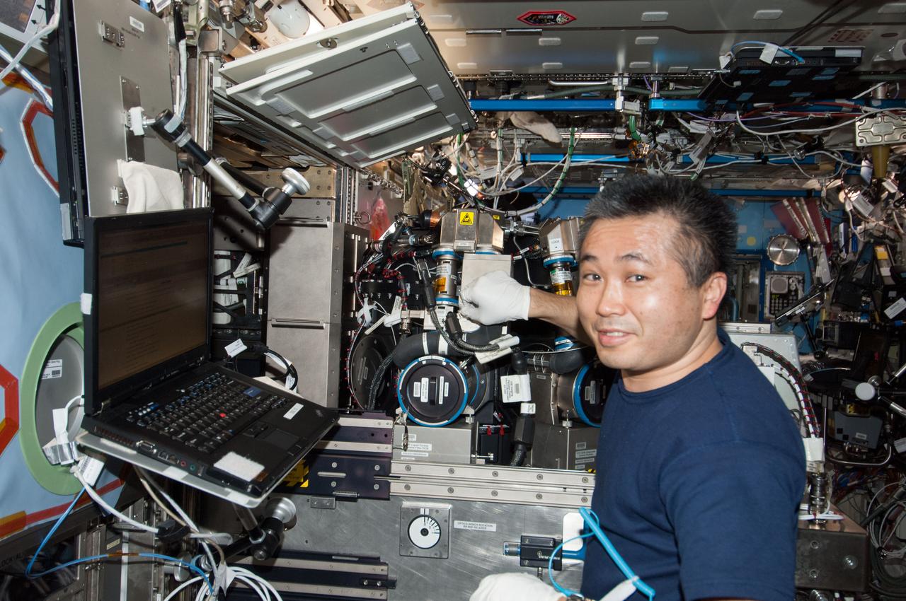 ISS038-E-042747 (5 Feb. 2014) --- Japan Aerospace Exploration Agency astronaut Koichi Wakata, Expedition 38 flight engineer, works on the Combustion Integrated Rack (CIR) in the Destiny laboratory of the International Space Station. This research rack, which includes an optics bench, combustion chamber, fuel and oxidizer control and five different cameras, allows a variety of combustion experiments to be performed safely aboard the station.
