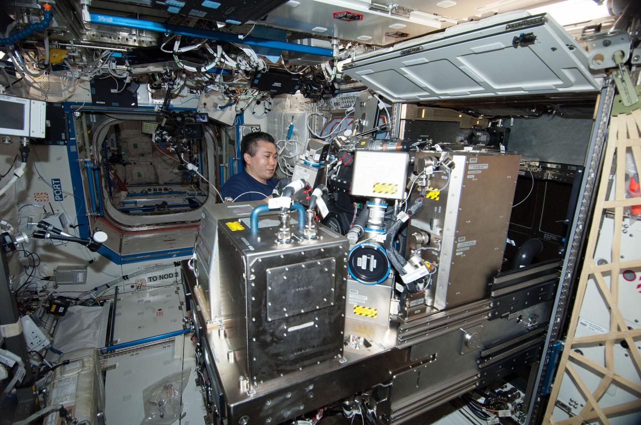 ISS038-E-042754 (5 Feb. 2014) --- Japan Aerospace Exploration Agency astronaut Koichi Wakata, Expedition 38 flight engineer, works on the Combustion Integrated Rack (CIR) in the Destiny laboratory of the International Space Station. This research rack, which includes an optics bench, combustion chamber, fuel and oxidizer control and five different cameras, allows a variety of combustion experiments to be performed safely aboard the station.
