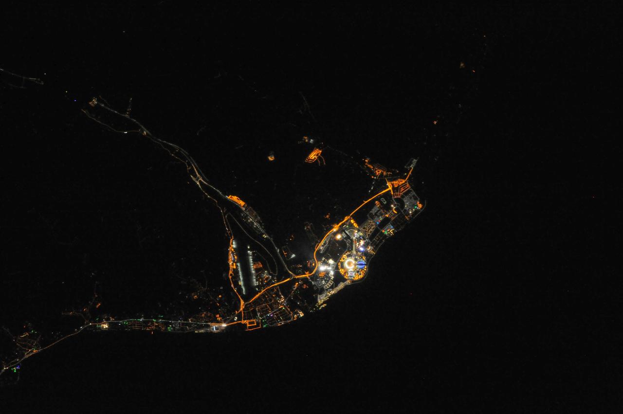 ISS038-E-042992 (10 Feb. 2014) --- One of the Expedition 38 crew members aboard the International Space Station downlinked this vertical 600mm night view of Sochi, Russia, which clearly shows the site of the 2014 Winter Olympics while they are just a few days underway. Fisht Stadium where the Opening Ceremonies were held on Feb. 7 is easily recognizable as the bright  circular structure. Sochi is a city in Krasnodar Krai, Russia, located on the Black Sea coast near the border between Georgia/Abkhazia and Russia. It has an area of 1,353 square miles or 3,505 square kilometers.