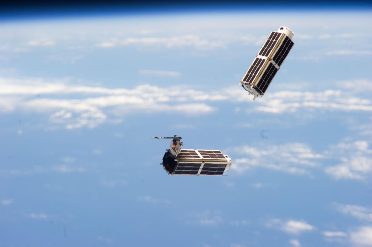 ISS038-E-044916 (11 Feb. 2014) --- A set of NanoRacks CubeSats is photographed by an Expedition 38 crew member after the deployment by the Small Satellite Orbital Deployer (SSOD). The CubeSats program contains a variety of experiments such as Earth observations and advanced electronics testing.