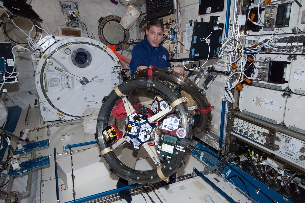 ISS038-E-045621 (10 Feb. 2014) --- NASA astronaut Mike Hopkins, Expedition 38 flight engineer, works with the Synchronized Position, Hold, Engage, Reorient, Experimental Satellites-Resonant Inductive Near-field Generation System (SPHERES-RINGS) experiment gear in the Kibo laboratory of the International Space Station.