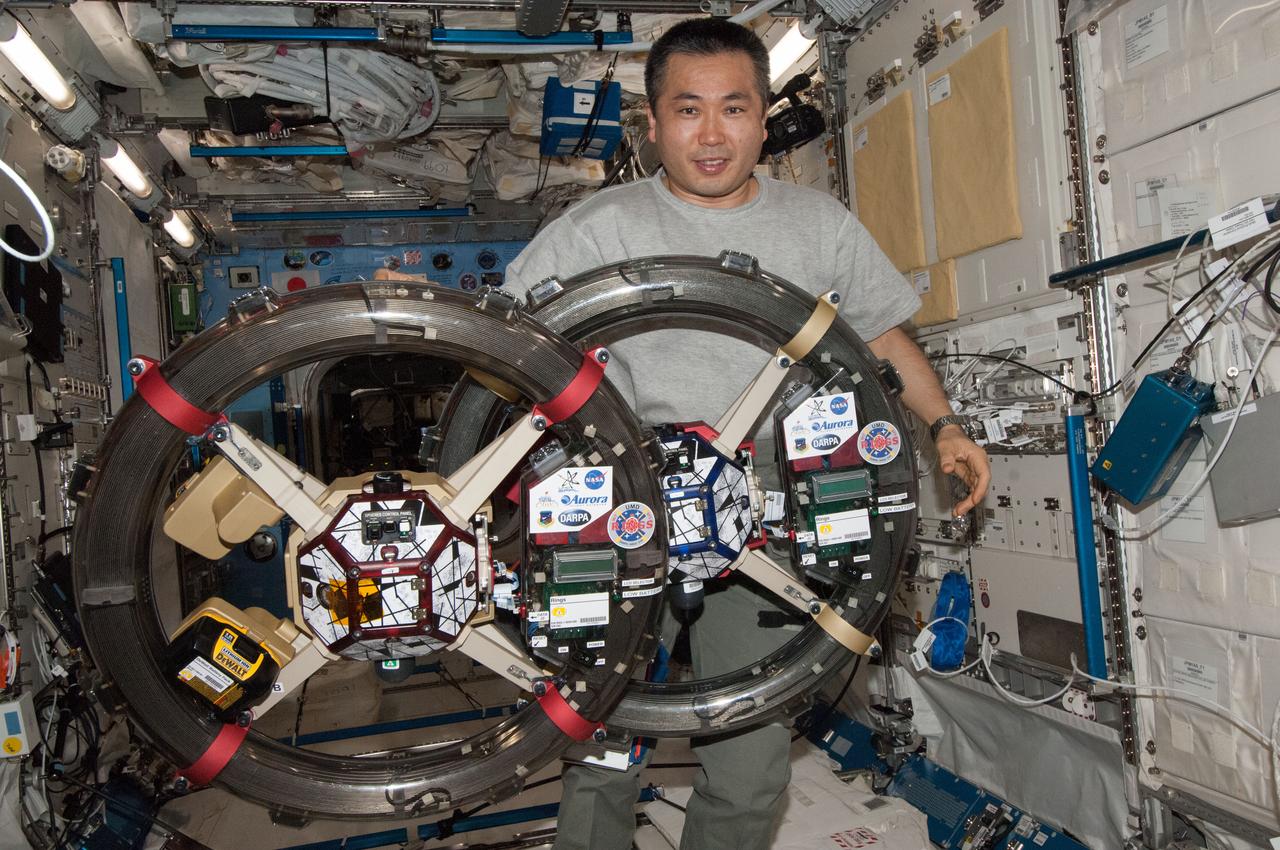 ISS038-E-045631 (10 Feb. 2014) --- Japan Aerospace Exploration Agency astronaut Koichi Wakata, Expedition 38 flight engineer, works with the Synchronized Position, Hold, Engage, Reorient, Experimental Satellites-Resonant Inductive Near-field Generation System (SPHERES-RINGS) experiment gear in the Kibo laboratory of the International Space Station.